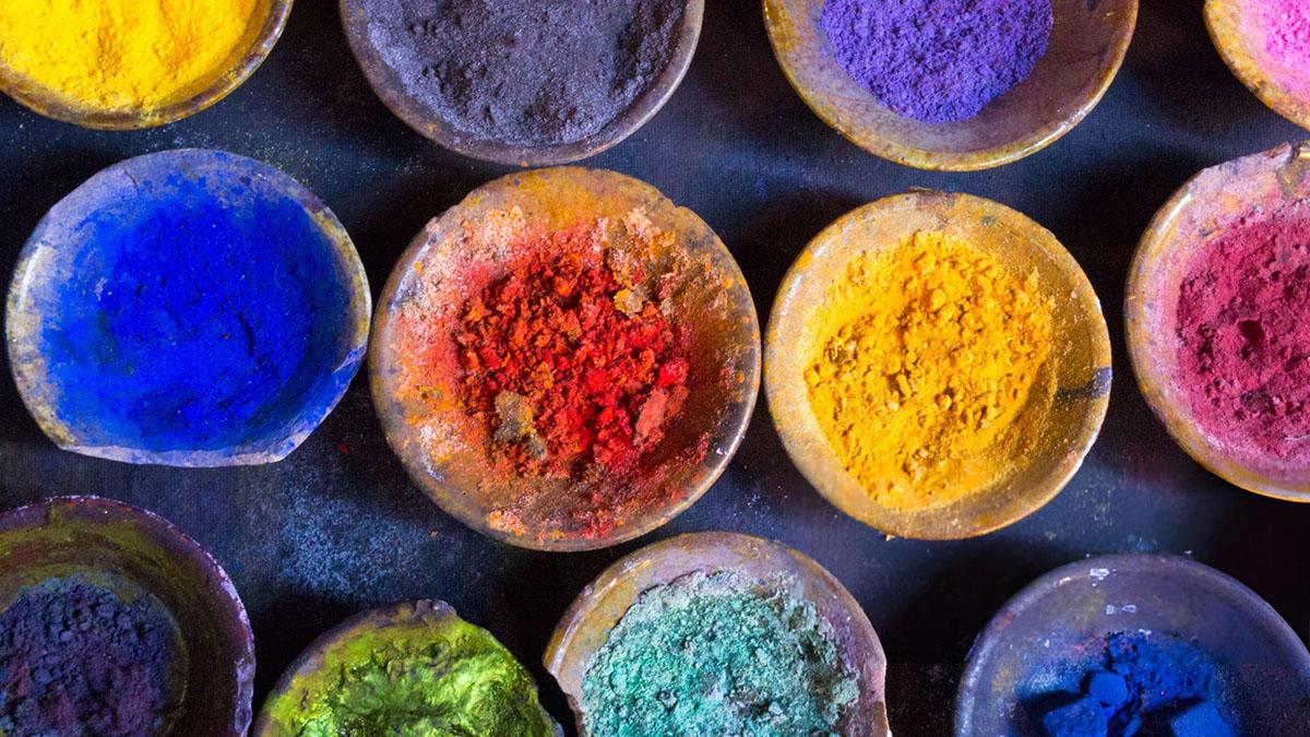 Assorted colourful powders in small bowls.