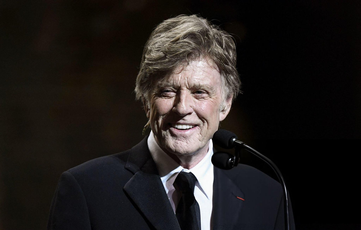 Robert Redford speaking at formal ceremony, representing his lasting cultural legacy built through principled career choices and advocacy work beyond Hollywood fame
