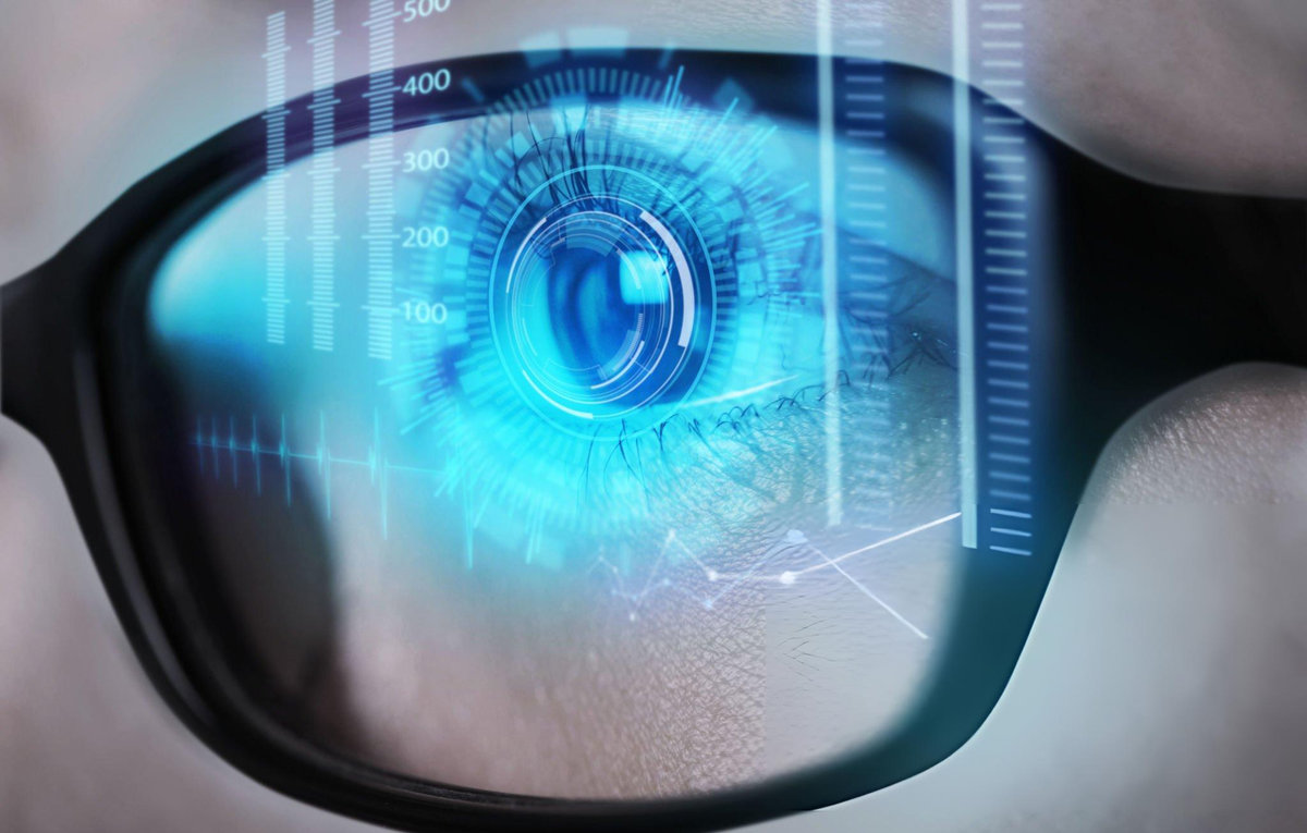 Close-up of human eye with digital scanning technology overlay showing vision assessment through eyeglasses for age-related eye health monitoring and protection