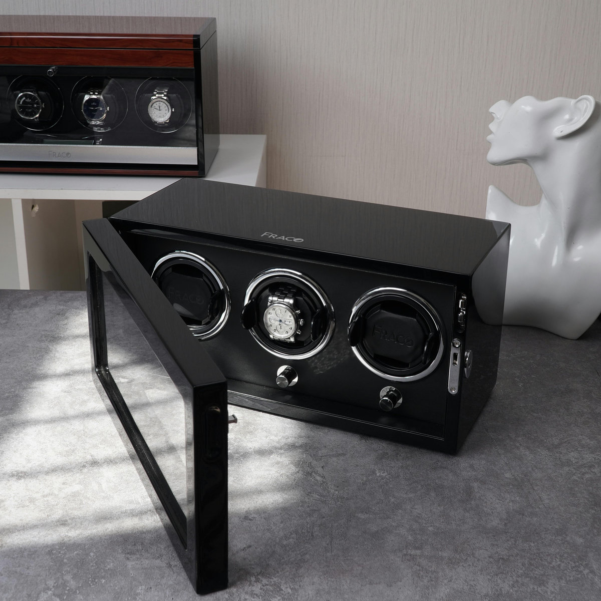 Luxury automatic watch winder displaying three mechanical timepieces in rotating storage mechanism for Australian collectors