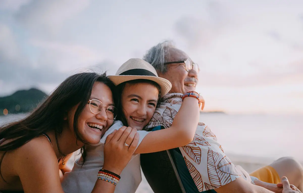 Happy family embracing on a beach