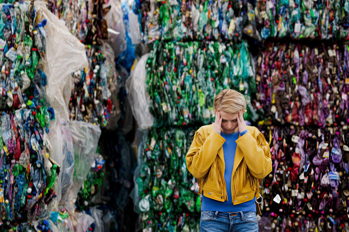 Compressed bales of plastic bottles at a recycling facility — The Fashion Globe