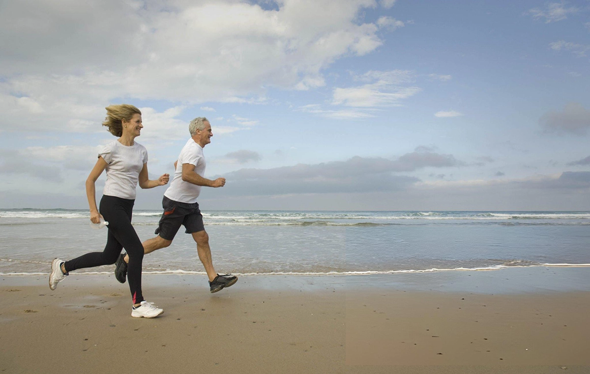 Couple running on a beach