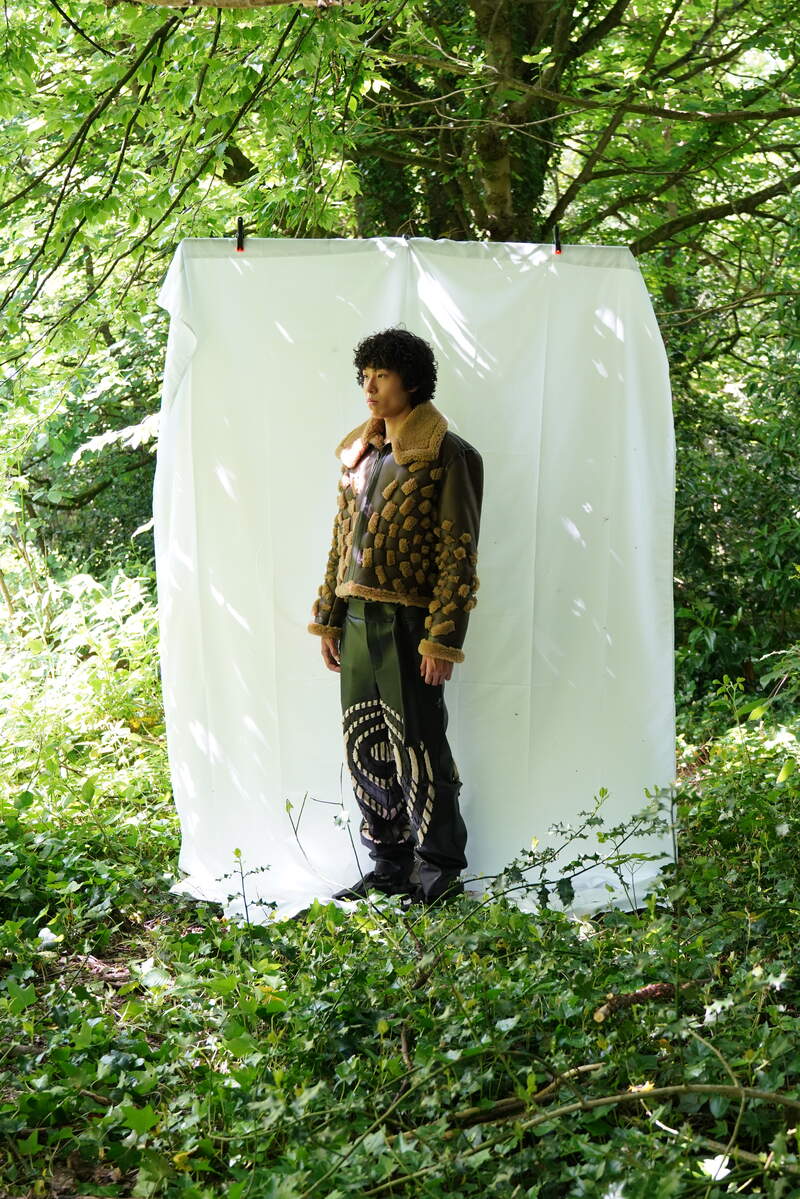 Hanwei Cheng – OBSCURE EPOQUE – Military Fabric Construction Hanwei Cheng 'OBSCURE EPOQUE' garment showing military fabric construction and sculptural menswear form